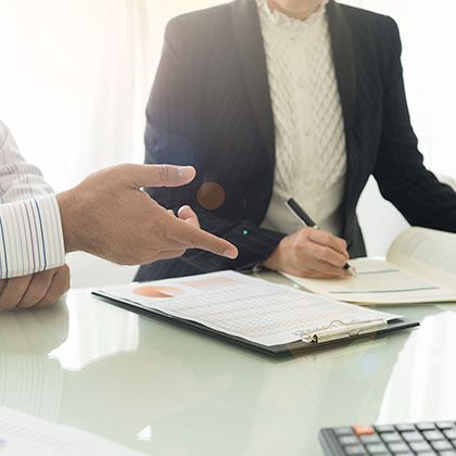 Man and woman discussing paperwork