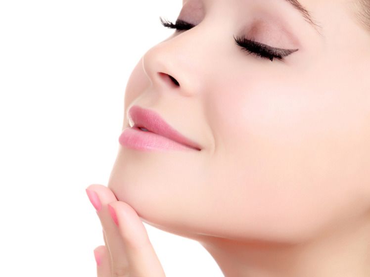 Close up of woman's closed eyes and profile
