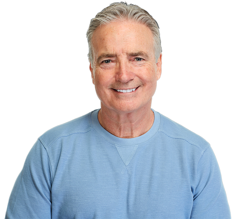 An older man with a complete smile