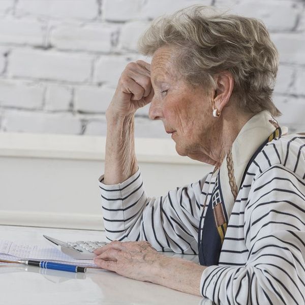 Upset senior woman on the computer