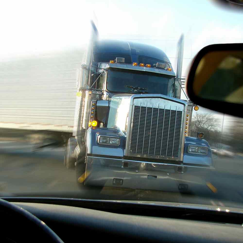 Truck swerving toward car