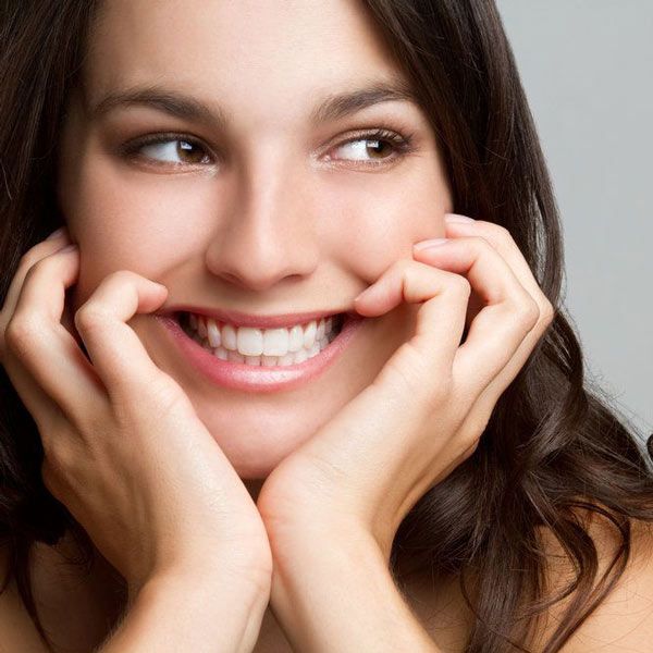 Woman smiling after having received a dental filling