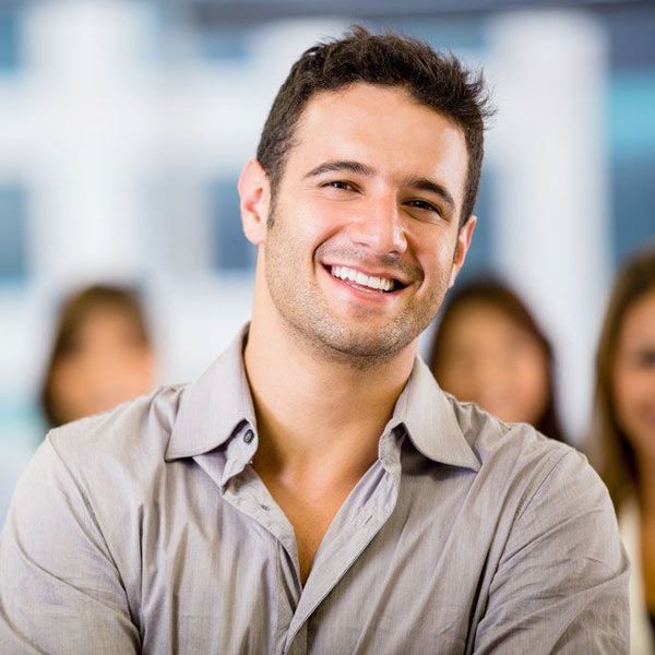 Man smiling after a full mouth reconstruction