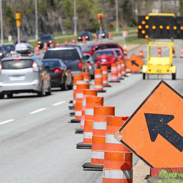 sign warning of road work ahead