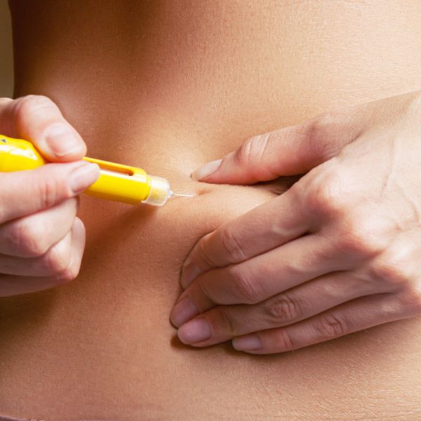 Doctor injecting medication