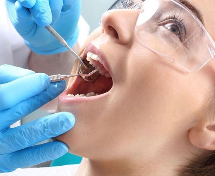 a woman having a dental exam
