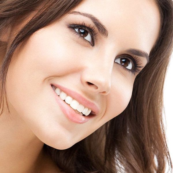 A smiling woman with brown hair