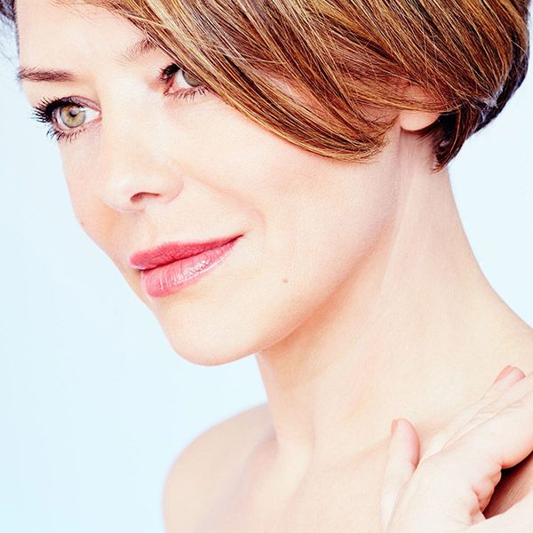 A middle-aged woman with green eyes