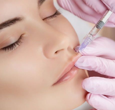 Woman receiving lip injections