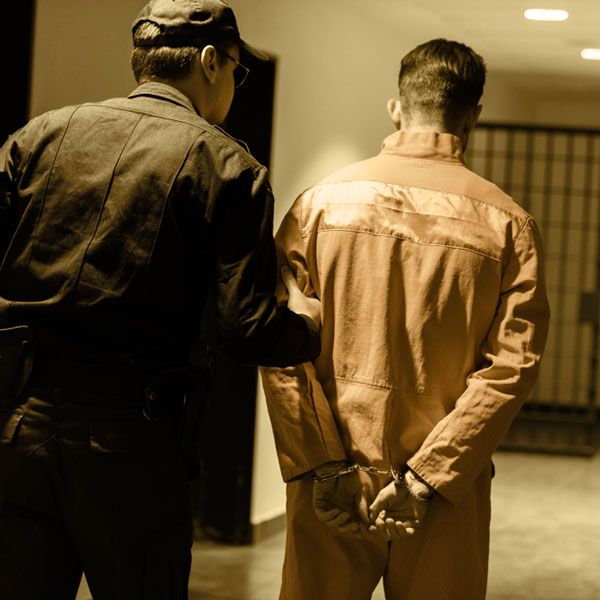 Convict being led to cell