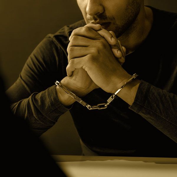 Concerned man in handcuffs