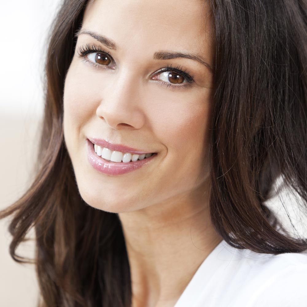 Smiling woman with dark hair
