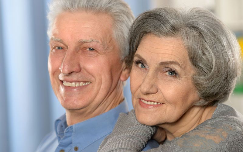 image of smiling couple with dental implants