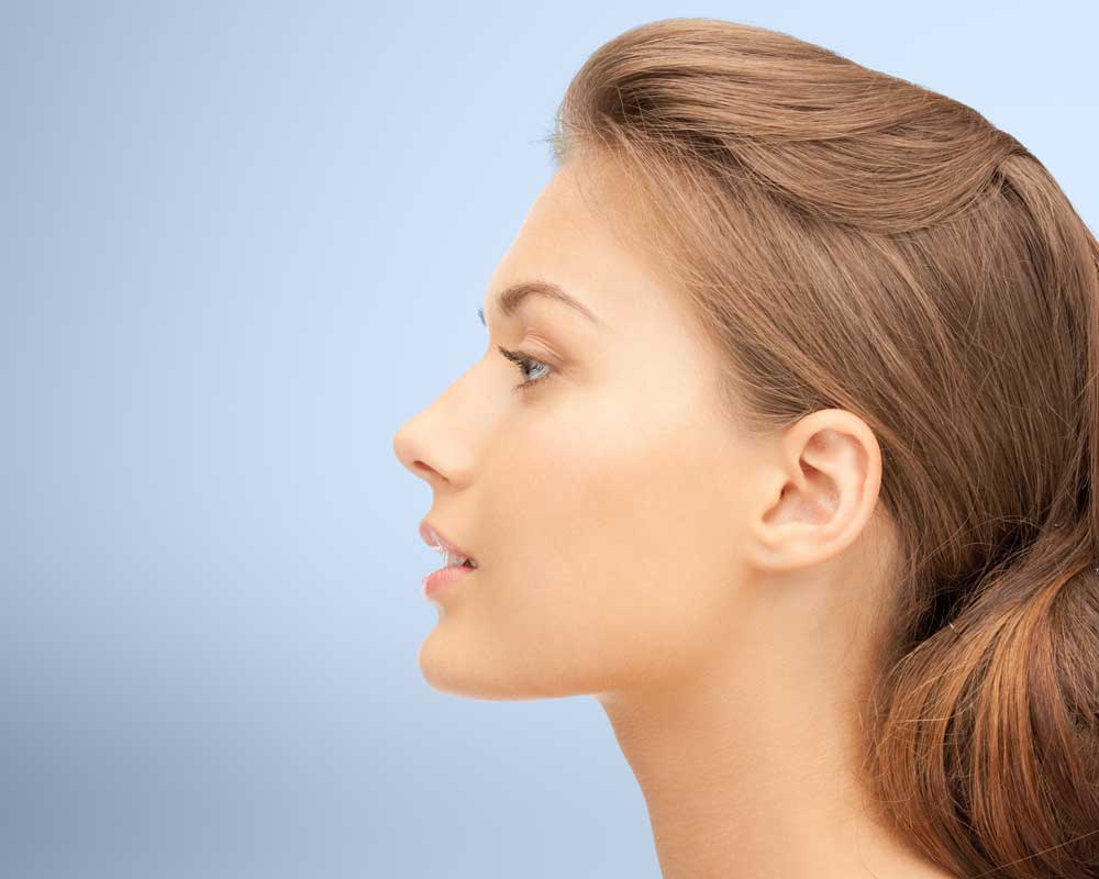 Profile of attractive woman staring to left of frame