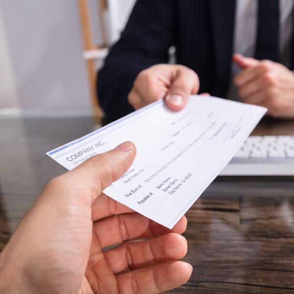 Men exchanging check