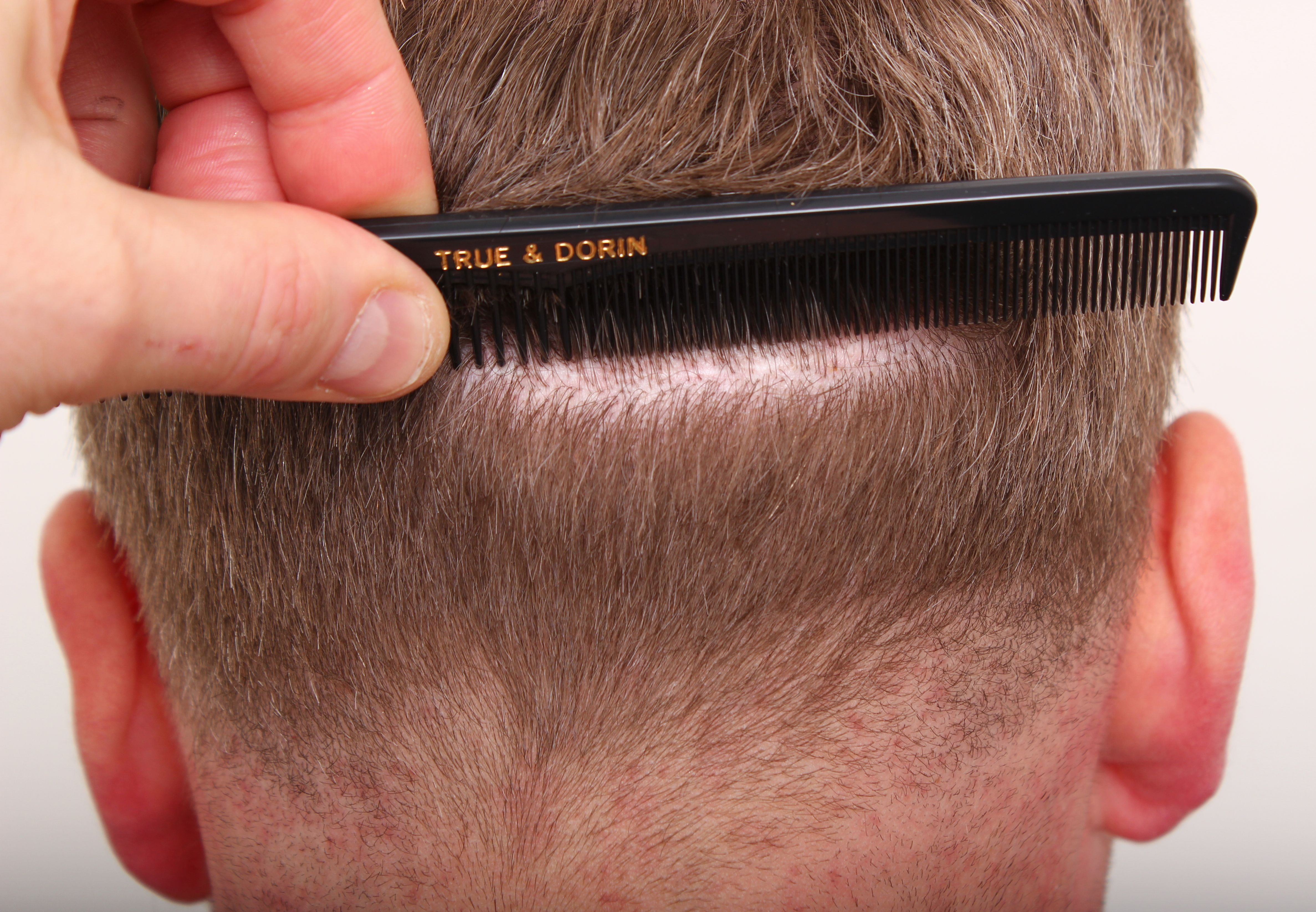 Close up of man parting hair