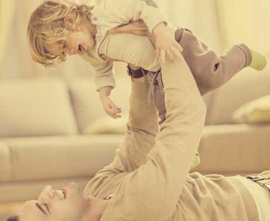 father playing with child