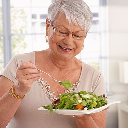Woman eating salad