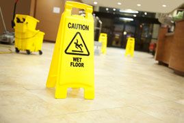 Yellow sign reading 'caution wet floor'