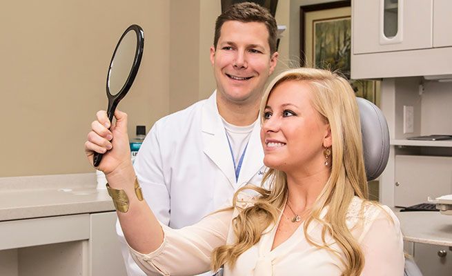 Dr. Jerry Hancock reviewing the results of treatment with a patient