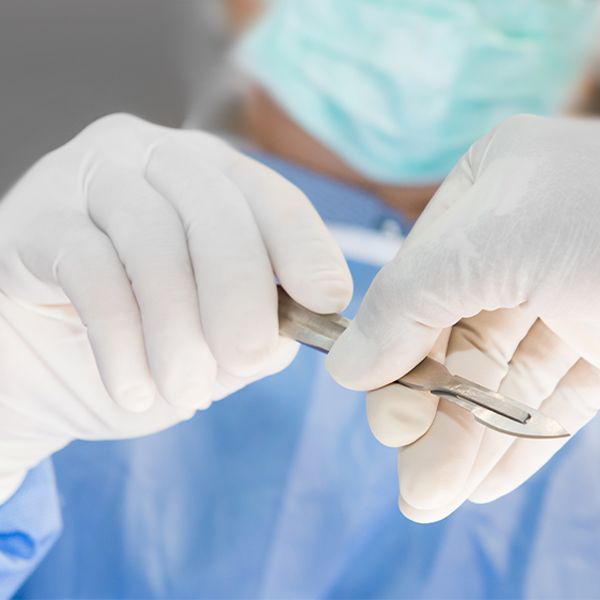 Surgical instrument in gloved hand