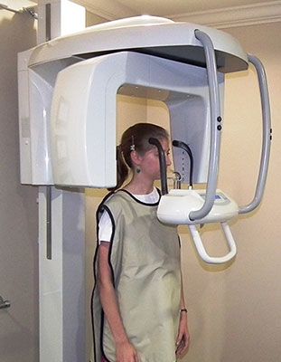 Woman undergoing panoramic x-ray