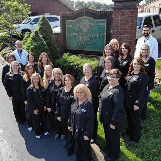 Drs. David and Jospeh Sutton with the team at Newport Family Dental Care