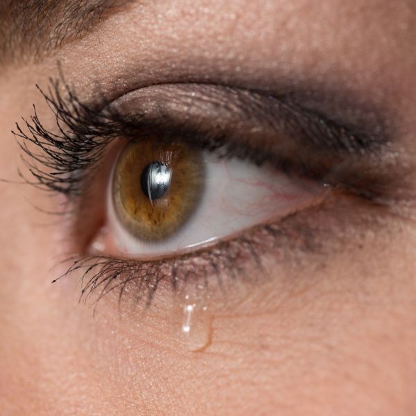 A woman's eye tearing