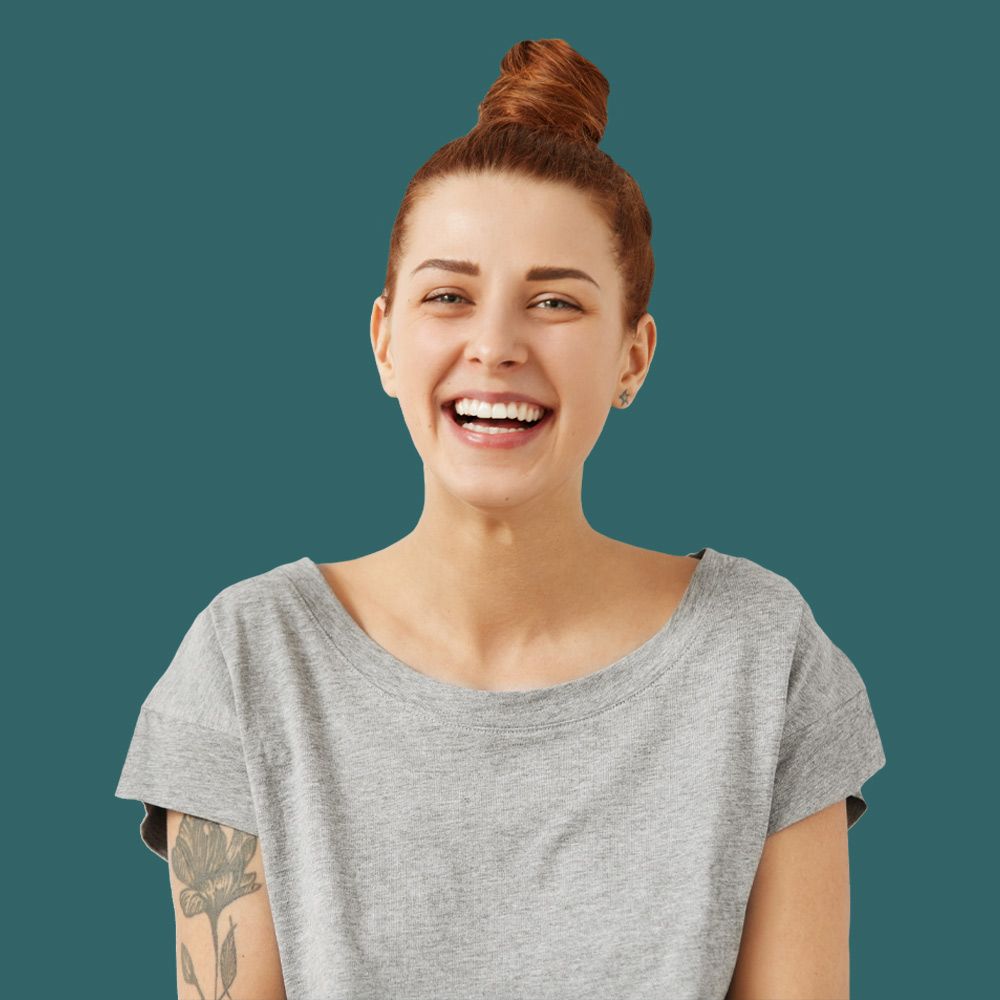 Smiling woman with hair in bun