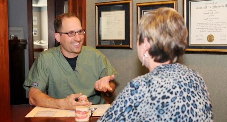 Dr. Nick Shumaker with a patient