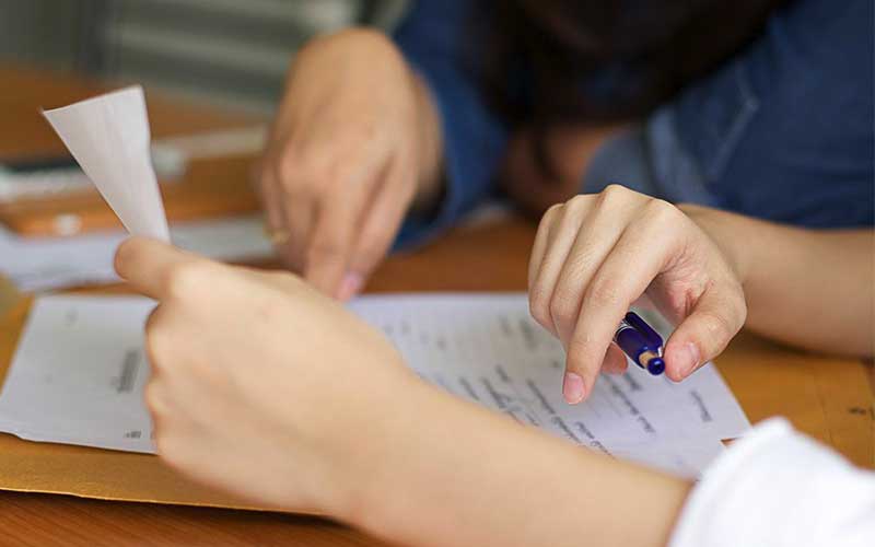 Man and woman completing paperwork together