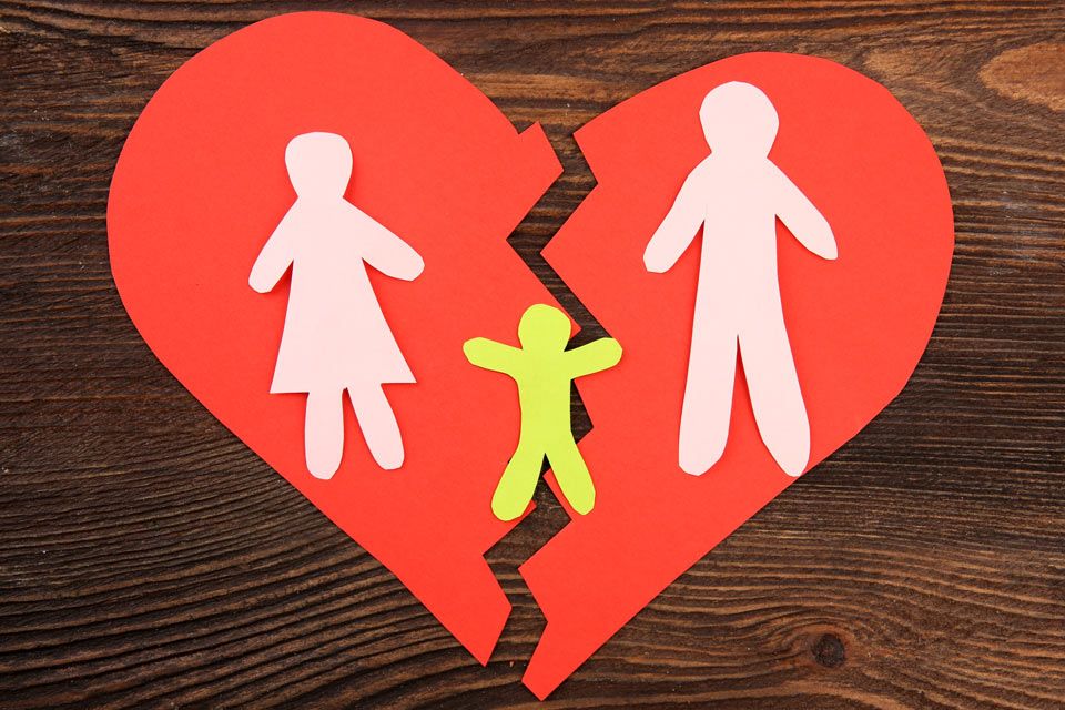 Construction paper heart and broken family