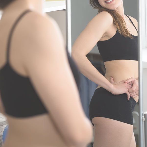 Woman looking in mirror
