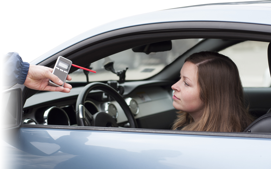 Driver undergoing breathalyzer test