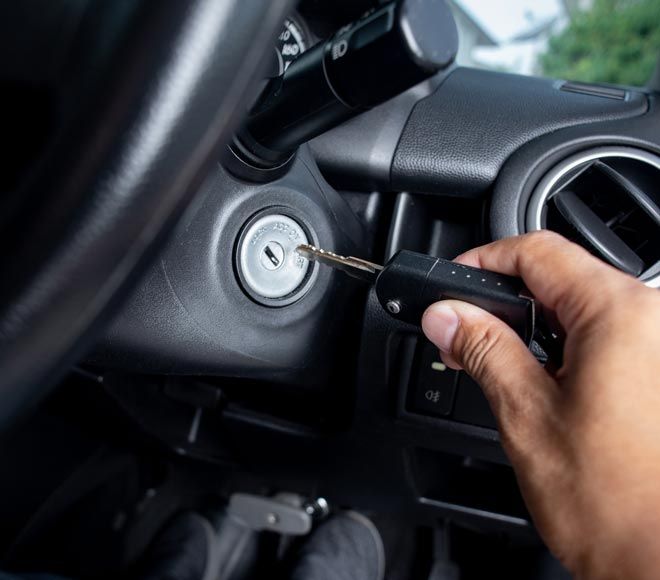 Man turning keys in ignition