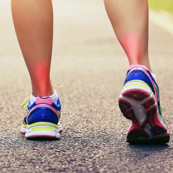 feet wearing running shoes