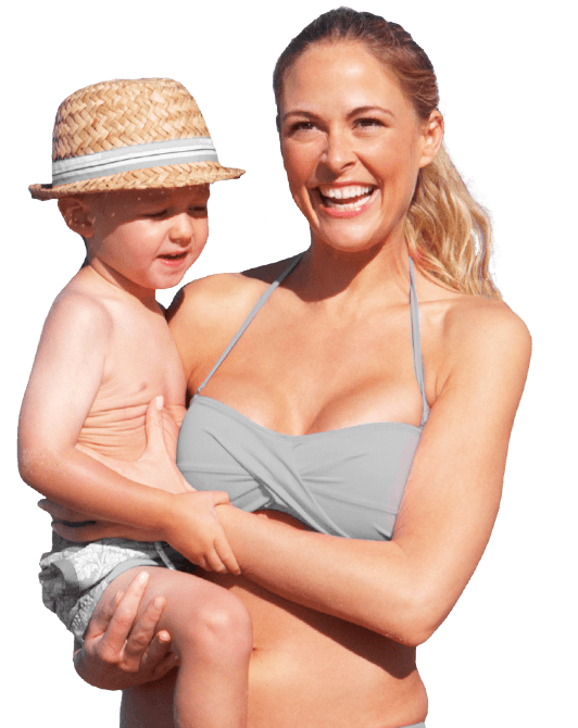 picture of mother carrying her toddler son against a plain black background