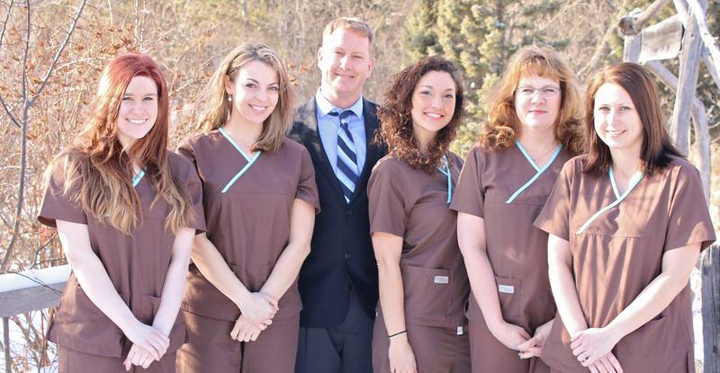 Dentist and staff at Woodland Family Dental