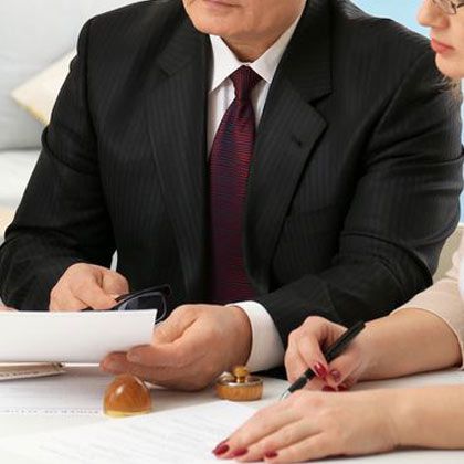 Man and woman reviewing documentation