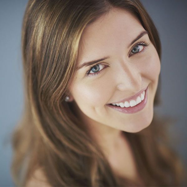 Woman smiling up at camera